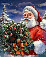 Father christmas holding a festive wreath cross stitch kit for beginners