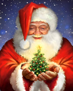 Father christmas holding a glowing tree cross stitch kit for beginners