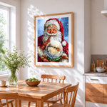 Father christmas holding a magic snow globe cross stitch artwork displayed on wall as home decor