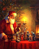 Father christmas looking at a nativity scene cross stitch kit for beginners