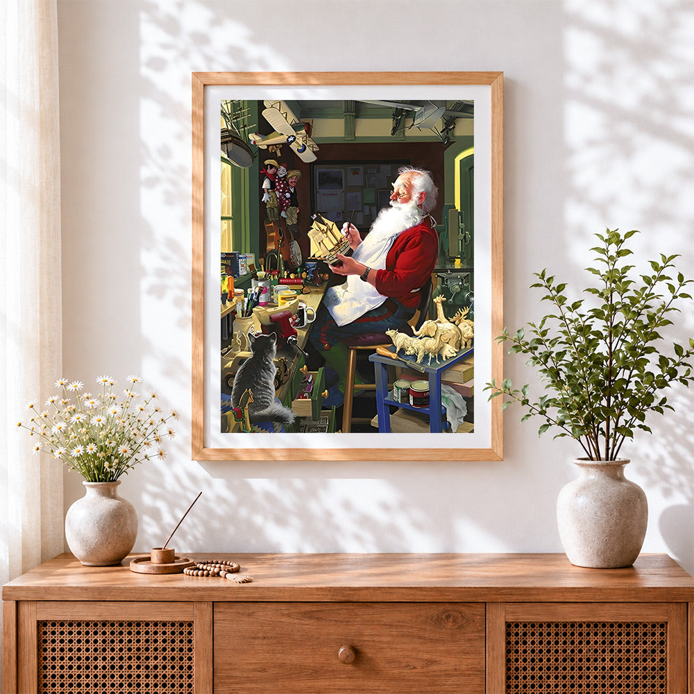 Finished father christmas making toys cross stitch artwork displayed