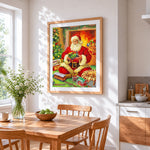 Father christmas playing with a toy train cross stitch artwork displayed on wall as home decor