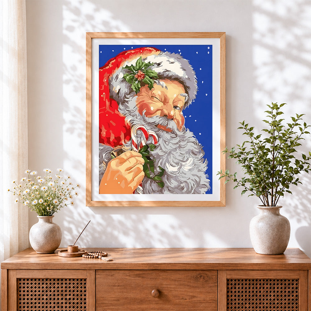 Finished father christmas with candy cane cross stitch artwork displayed