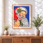 Finished father christmas with candy cane cross stitch artwork displayed