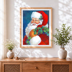 Finished father christmas with holly wreath cross stitch artwork displayed