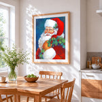 Father christmas with holly wreath cross stitch artwork displayed on wall as home decor