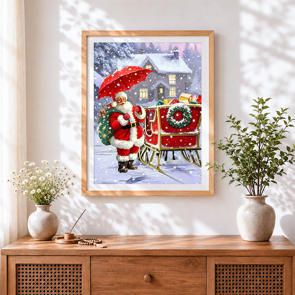 Finished father christmas with red umbrella and sleigh cross stitch artwork displayed