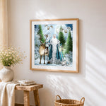 Father christmas with reindeer in winter forest cross stitch artwork displayed on wall as home decor