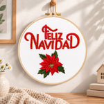 Feliz navidad poinsettia embroidery hoop wall art displayed as warm and cozy handmade home decor