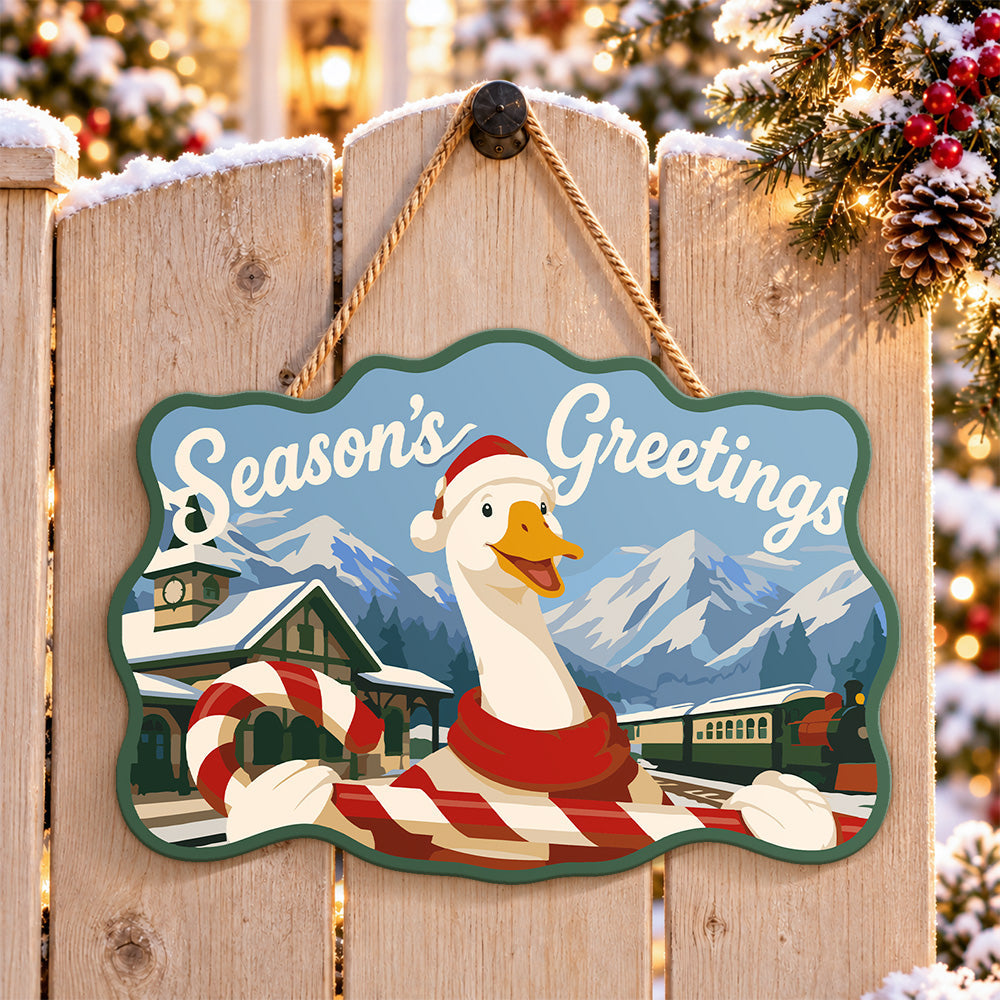 Festive goose with candy cane paint by numbers door hanger on a garden gate