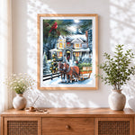 Finished festive horse-drawn sleigh by a snowy house cross stitch artwork displayed