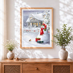 Finished festive snowman and robin by a snowy house cross stitch artwork displayed