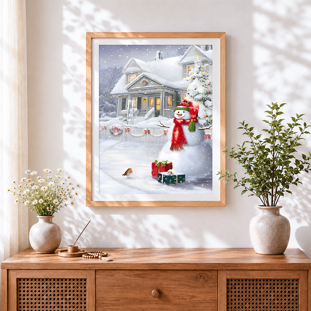 Finished festive snowman and robin by a snowy house cross stitch artwork displayed