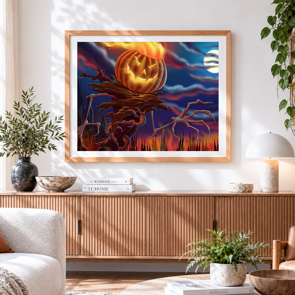 Finished fiery pumpkin scarecrow cross stitch artwork displayed