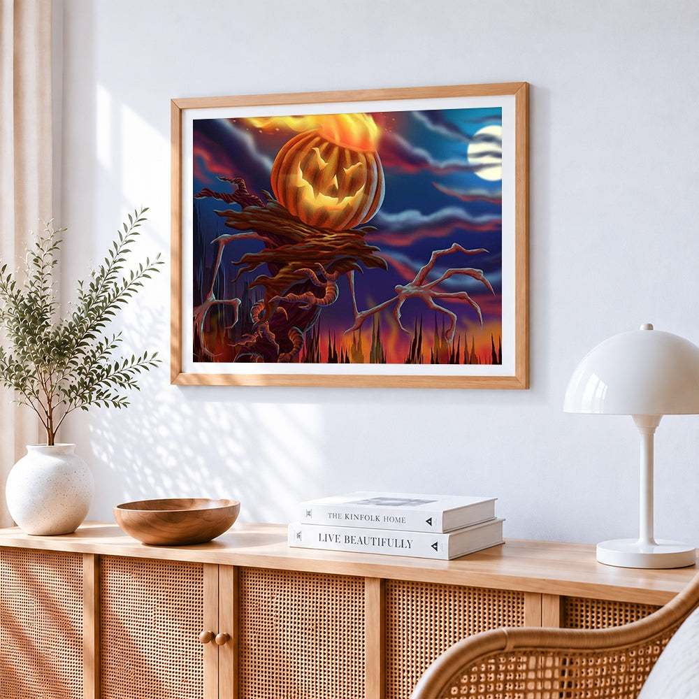 Fiery pumpkin scarecrow cross stitch artwork displayed on wall as home decor