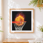 Finished flaming basketball hoop cross stitch artwork displayed