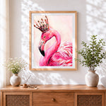 Finished flamingo with crown cross stitch artwork displayed