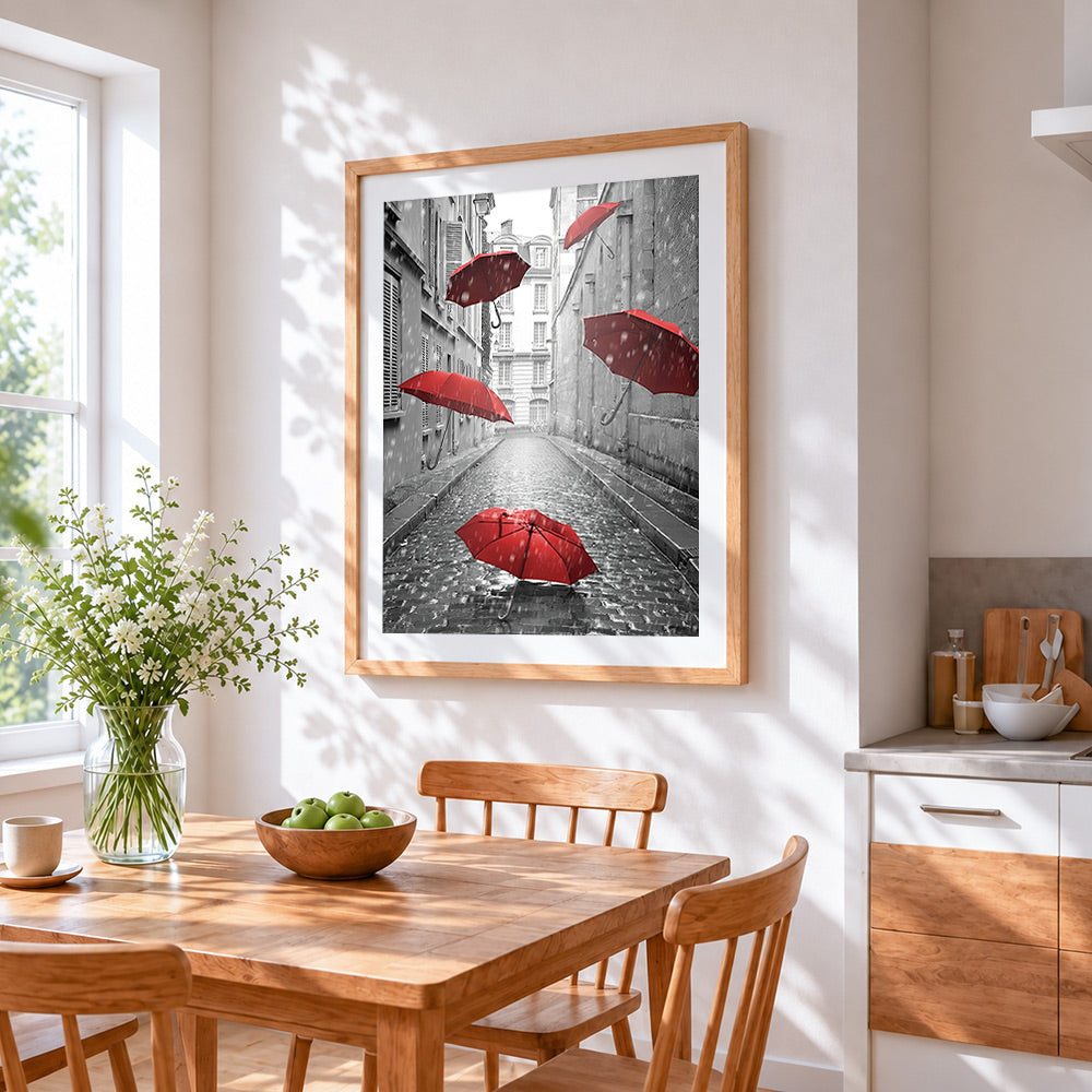 Floating red umbrellas cross stitch artwork displayed on wall as home decor