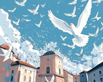 Flock of white doves flying over a city cross stitch kit for beginners