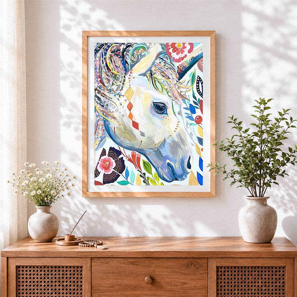 Finished floral abstract white unicorn cross stitch artwork displayed