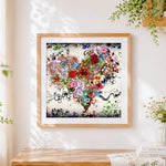 Finished floral and koi fish heart collage paint by numbers artwork displayed as home decor