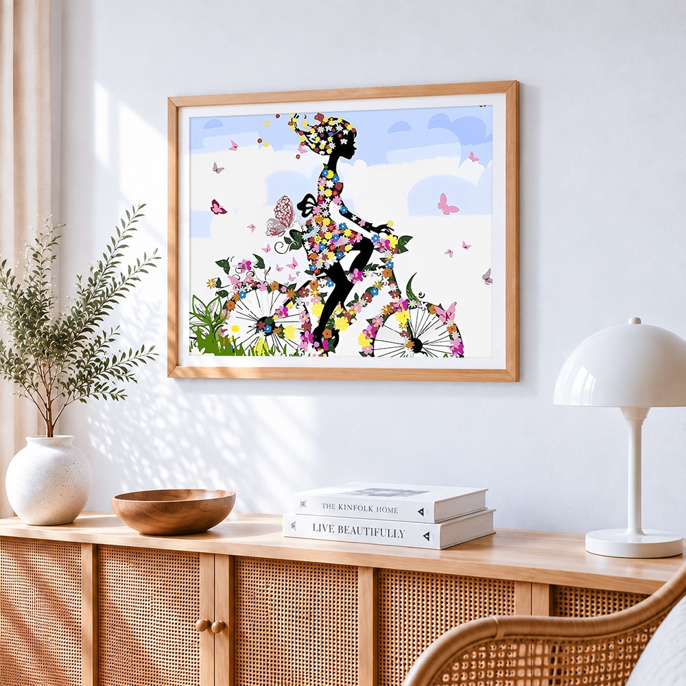 Floral bicycle woman silhouette paint by numbers artwork displayed on wall as home decor