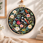 Floral birds on branches embroidery hoop wall art displayed as warm and cozy handmade home decor