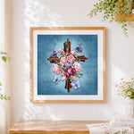Finished floral cross with butterflies cross stitch artwork displayed