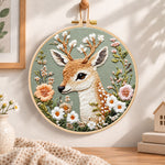 Floral fallow deer embroidery hoop wall art displayed as warm and cosy handmade home decor