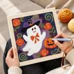 Creating handmade floral ghost with witch hat punch needle artwork