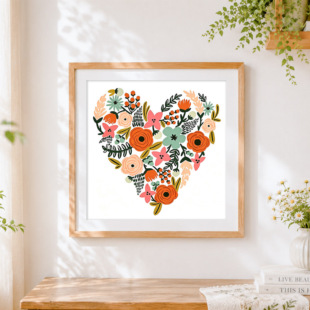 Finished floral heart illustration cross stitch artwork displayed