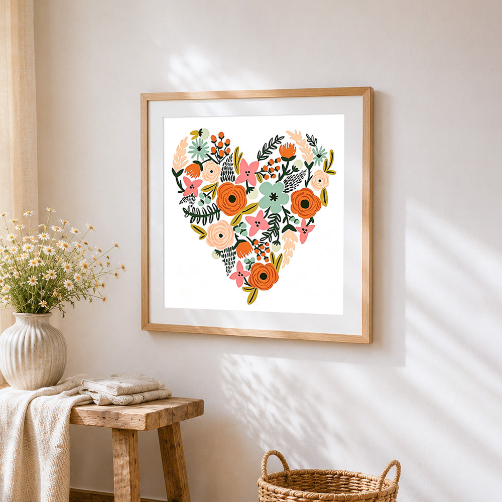 Floral heart illustration cross stitch artwork displayed on wall as home decor