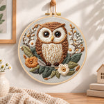 Floral owl portrait embroidery hoop wall art displayed as warm and cosy handmade home decor