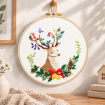 Floral reindeer art embroidery hoop wall art displayed as warm and cosy handmade home decor