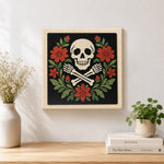 Finished floral skull and crossbones artwork displayed on a wall