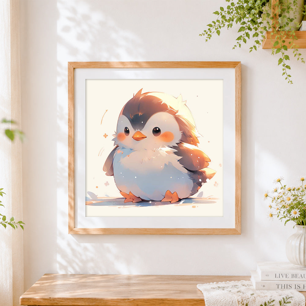 Finished fluffy baby penguin cross stitch artwork displayed
