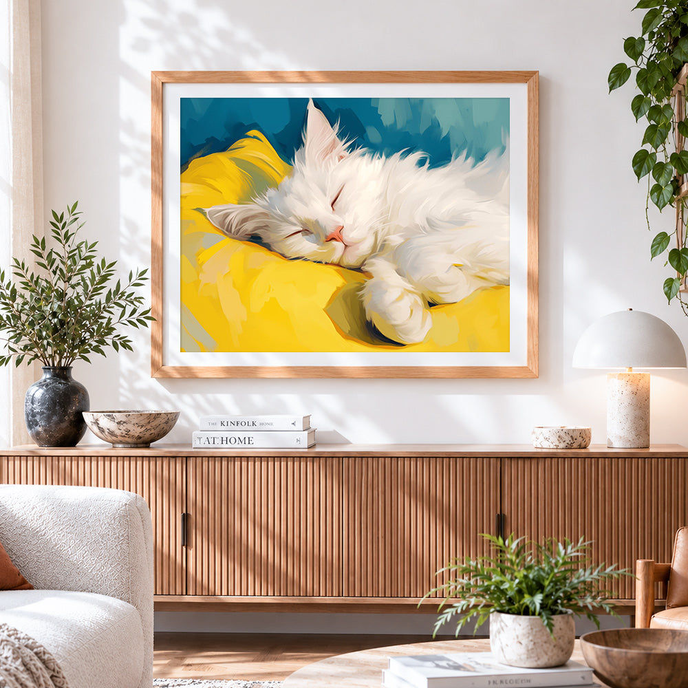 Finished fluffy white cat sleeping on a yellow pillow cross stitch artwork displayed