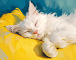 Fluffy white cat sleeping on a yellow pillow cross stitch kit for beginners