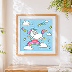 Finished flying unicorn with shooting stars cross stitch artwork displayed
