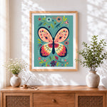 Finished folk art butterfly and flowers cross stitch artwork displayed