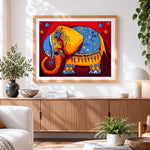 Finished folk art painted elephant cross stitch artwork displayed
