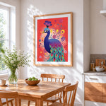 Folk art peacock on red background cross stitch artwork displayed on wall as home decor