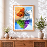 Finished four seasons tree and church cross stitch artwork displayed
