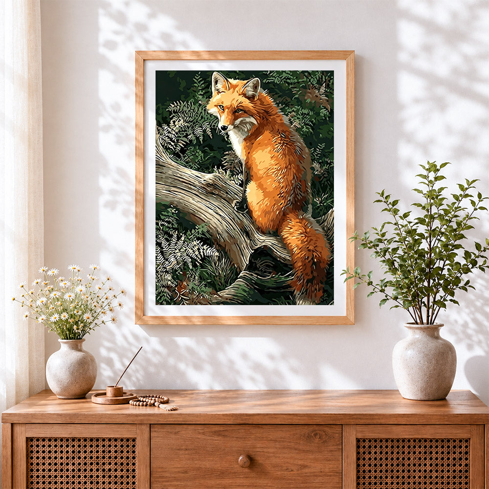 Finished fox on a tree branch cross stitch artwork displayed