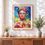 Finished frida kahlo with flowers cross stitch artwork displayed