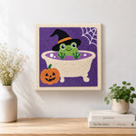 Finished frog bath time artwork displayed on a wall