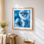 Frosty blue dandelions paint by numbers artwork displayed on wall as home decor