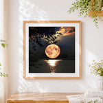 Finished full moon over tranquil lake cross stitch artwork displayed