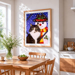 Fun cat with a snowman cross stitch artwork displayed on wall as home decor