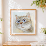 Finished funny big eyed kitten cross stitch artwork displayed